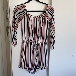 Pink, white, and blue romper.